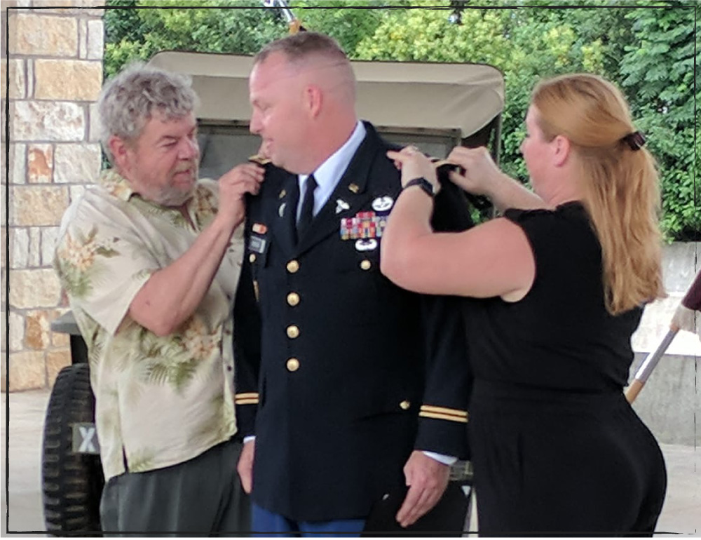 Lisa Benson with her husband Rick Benson the day he was promoted to Major. Also, featured Richard Benson. (photo supplied by Lisa Benson)